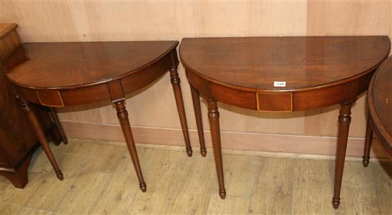 A pair of Georgian style mahogany demi-lune console tables, W.3ft